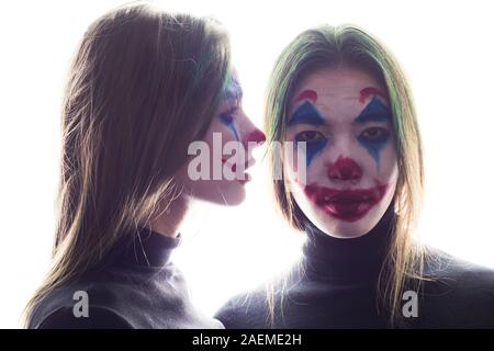 Girls with clown makeup isolated on white background. Stock Photo