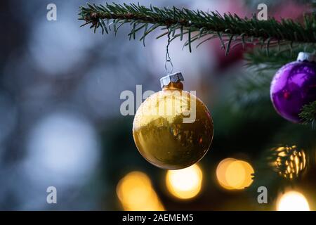 Stuttgart, Germany. 09th Dec, 2019. A golden Christmas ball with drops of water hangs from a Christmas tree. Credit: Tom Weller/dpa/Ģ����ý Live News Stock Photo