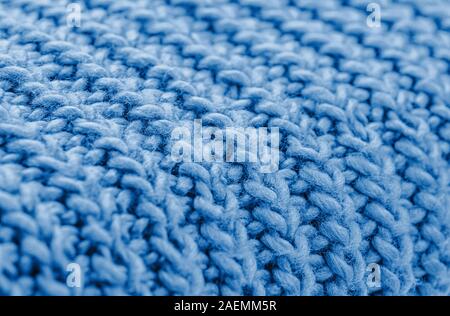 Blue knitted fabric closeup. Knitted wool background. Handmade. Close up. Stock Photo