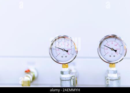 Air Pressure gauge behind machines ; For ensure pressure from main pipe of factory ; industrial engineering background Stock Photo