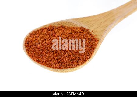 Spoon full of Paprika spices, a sweet pepper isolated on a white background Stock Photo