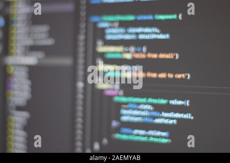 Blurry programming language on black screen background, recognazible code outline Stock Photo