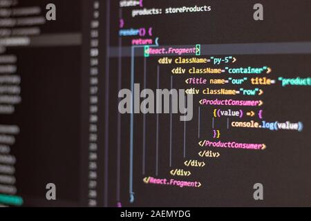 Programming language on black screen background, Javascript React code Stock Photo
