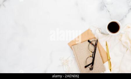 Stylish feminine accessories and office supply on marble background. Flat lay, top view. Beauty blogger workspace concept. Stock Photo