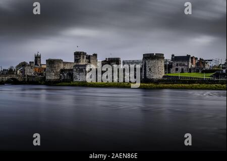 King John's Castle on the banks of the River Shannon.  Beautifil old castle marred only by a visitors centre built in. place of one of castle walls. Stock Photo