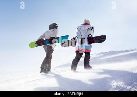Young couple walking in ski resort Stock Photo