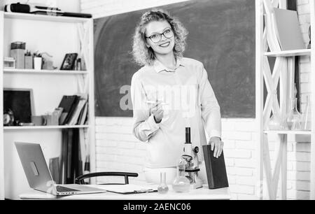 onstantly learning new skills. Girl adorable teacher in classroom. Formal education. Teachers day. Teacher difficult but very rewarding profession. Teacher pretty woman enjoy educational process. Stock Photo