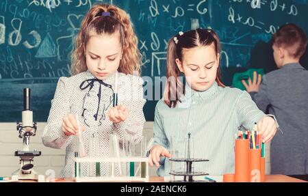 Little children. Science. Little kids scientist earning chemistry in school lab. biology experiments with microscope. Chemistry science. Lab microscope and testing tubes. School curriculum. Stock Photo