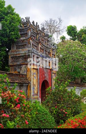 Colorful gate between two areas inside of Purple Forbidden city (Imperial Citadel) in Hue, Vietnam Stock Photo