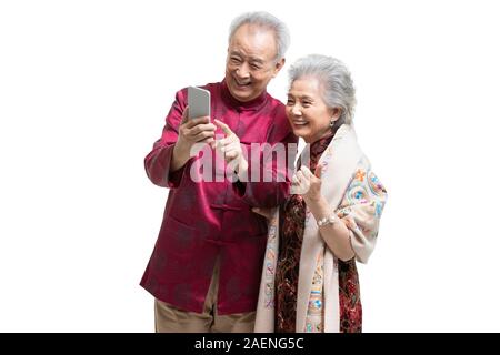 Happy senior couple using smartphone Stock Photo