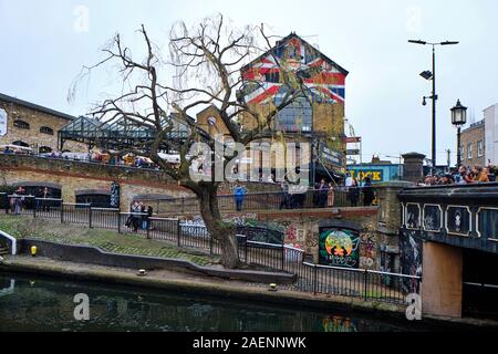 LONDON, UK - DECEMBER 30, 2018: Visitors at Camden Lock. Camden Lock, Camden Market, and streets nearby are the fourth-most popular attraction in the