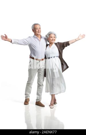 Happy senior couple standing side by side Stock Photo