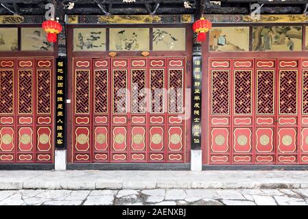 March 7, 2019: Chinese wooden red and golden door Stock Photo