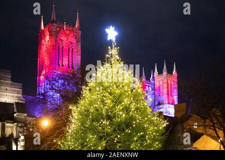 Lincoln Cathedral floodlit using coloured light introduced in 2019. Picture taken from the back of the Cathedral. Stock Photo