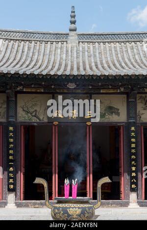 Burning incense sticks in a Chinese Temple in Jianshui, China Stock Photo