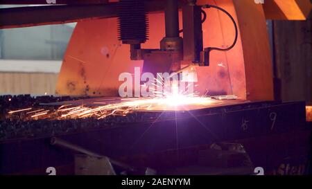 Industrial laser cutting with high precision processing manufacture technology of flat sheet metal steel material with sparks Stock Photo