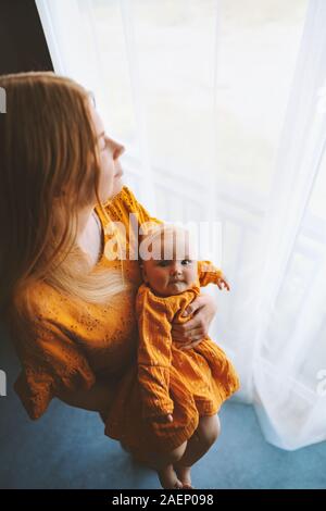 Mother and baby daughter at home family lifestyle mom and infant child together  maternity love concept Mothers day holiday Stock Photo