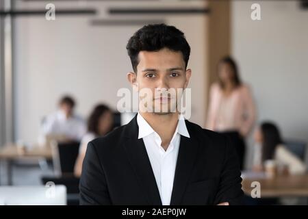 Head shot portrait of confident middle eastern businessman in office Stock Photo
