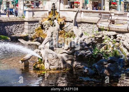 DUSSELDORF, GERMANY - JULY 02, 2018: Triton Fountain or Tritonenbrunnen located at Konigsallee or King's Avenue in Dusseldorf city in Germany Stock Photo