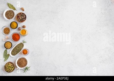Spices Assortment on white background. Set of various spices and condiments flat lay with copy space.