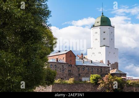 Beautiful view of the Vyborg Castle in sunlight on the background of cloudy sky, Vyborg, Leningrad Oblast, Russia Stock Photo