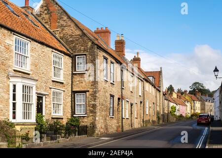 Old stone-built houses along a main street. Bath Road, Wells, Mendip, Somerset, England, UK, Britain Stock Photo