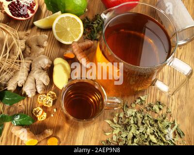 Tea with different ingredients on wooden Background Stock Photo