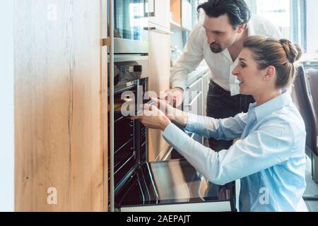 Woman and man deciding on buying a new kitchen Stock Photo