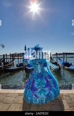 Traditional Venetian mask at Venice Carnival in st. Mark's square, Venice, Italy Stock Photo