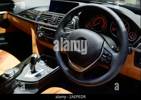 Car interior luxury steering wheel and dashboard Stock Photo
