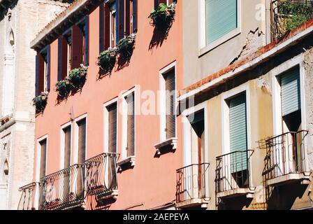 Windows in old houses facades Stock Photo