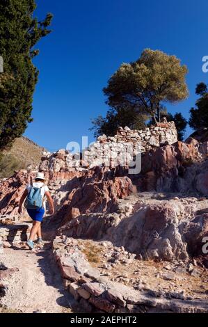 Walker on Footpath from Mikro Horio to Lethra Beach, Tilos, Dodecanese islands, Southern Aegean, Greece. Stock Photo