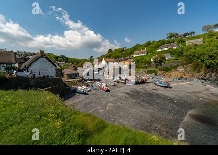 The harbour with some fishing boats of Cadgwith in South Cornwall, England, United Kingdom, Great Britain Stock Photo