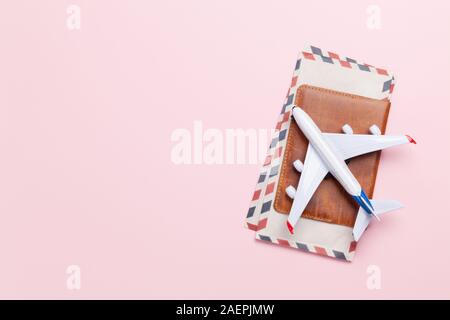 Travel concept with airplane toy and passport. Top view flat lay with copy space Stock Photo