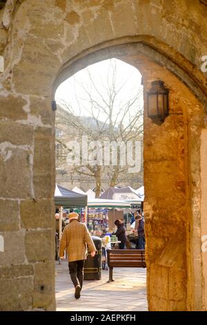 Wells is a Cathedral city in somerset UK. Winter view of the market through the Penniless Arch Stock Photo