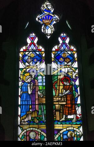 Stained glass window in the Anglo-Saxon church of All Saints in the village of Earls Barton, Northamptonshire, UK Stock Photo