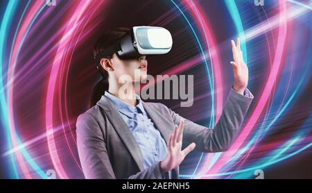 Business Woman In VR Glasses Experiencing Virtual Reality Stock Photo