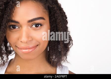 Close up portrait of beautiful smiling black girl Stock Photo
