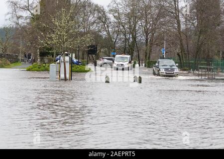 Aberfoyle, Stirlingshire, Scotland, UK. 10th Dec, 2019. UK weather - flooded car park and car charging points in Aberfoyle after the River Forth bursts its banks Credit: Kay Roxby/Alamy Live News Stock Photo