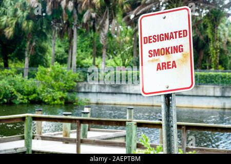 Port St. Saint Lucie Florida,North Fork St. Saint Lucie River Aquatic Preserve,Veterans Memorial Park,outdoor designated smoking area,sign,FL190920011 Stock Photo