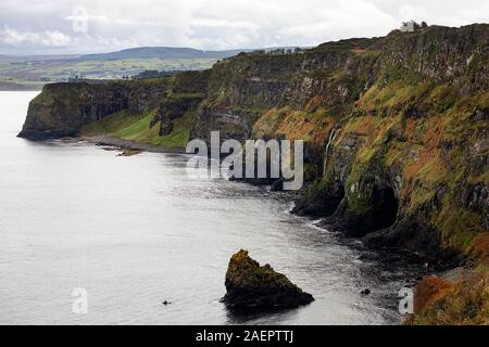 cliffs at Kinbane Castle with a waterfall, spectacularly situated on the Antrim coast in Northern Ireland, uk Stock Photo