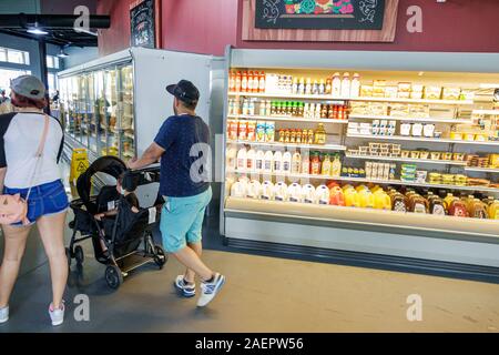 St. Saint Cloud Florida,Harmony,planned community,Town Square Market Groceries,store,dairy case,man men male adult adults,woman women female lady adul Stock Photo