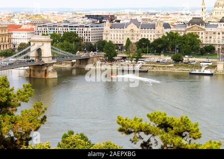 BUDAPEST, HUNGARY 29 JULY 2019: beautiful view of Chain Secheny Bridge over Danube River, Gresham Palace and Saint Stephen's Basilica from Buda Castle Stock Photo