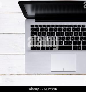 Open laptop with blank screen on a white background top view Stock Photo