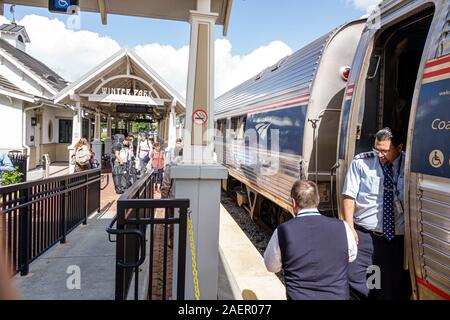 Orlando Winter Park Florida,Amtrak/Sunrail Amtrak Sunrail Station,train railway station,depot,platform,track,boarding,passengers riders,conductor,crew Stock Photo