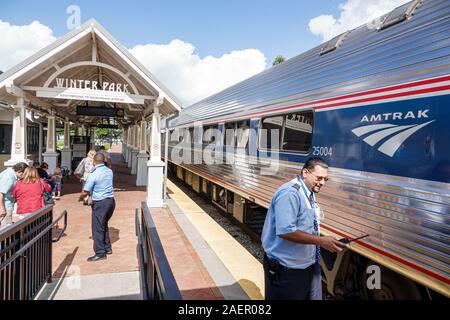 Orlando Winter Park Florida,Amtrak/Sunrail Amtrak Sunrail Station,train railway station,depot,platform,track,boarding,passengers riders,conductor,crew Stock Photo