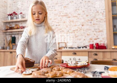 Attractive young child working in the kitchen