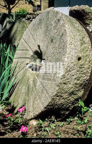 Close up vintage grinding wheel stone at a gristmill, Lancaster county, Pennsylvania, PA, USA, vertical farming Pa images historical images Stock Photo