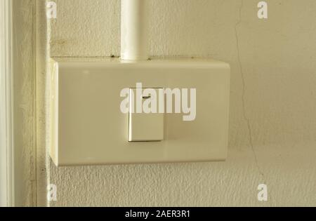 toggle switch in plastic box on the wall Stock Photo