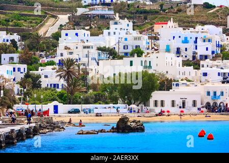 Mykonos, Greece - April 23, 2019: Famous island white houses, promenade, beach, view from the sea in Cyclades Stock Photo